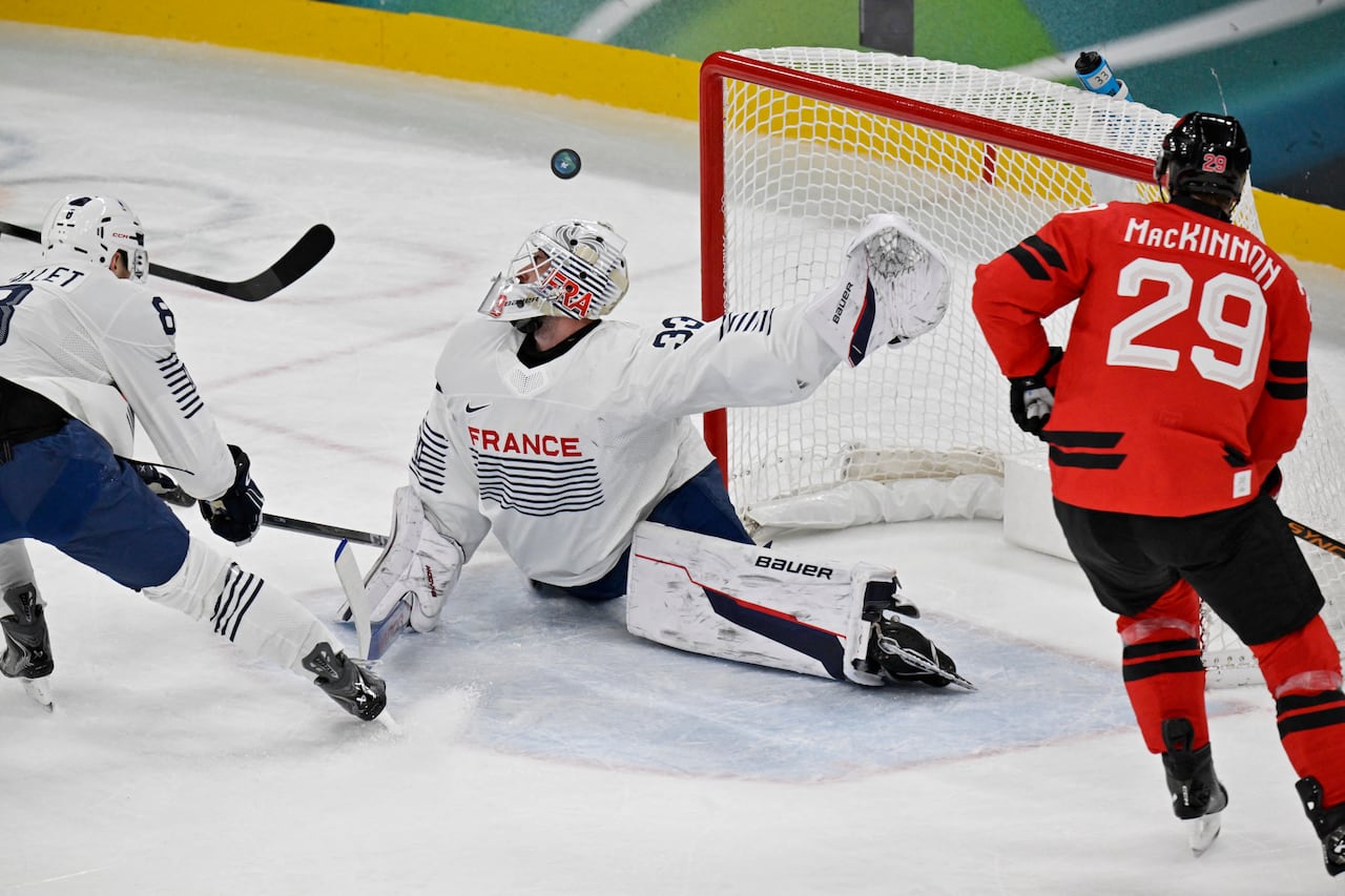 A goalie makes a save.