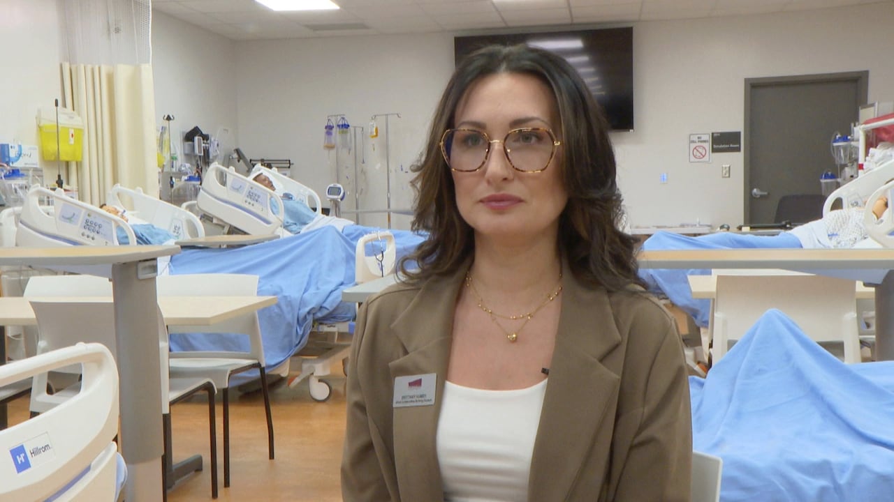 Nursing student sits in clinical room
