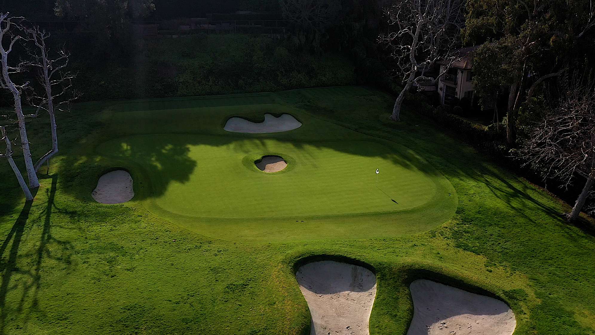An aerial view of the par-3 sixth hole at The Riviera Country Club, featuring the unique bunker in the center of the green. (PGA TOUR)