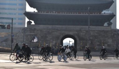 Cyclists ride past Namdaemun Gate during a Critical Mass ride in Seoul, Jan. 17. Courtesy of Bereket Alemayehu
