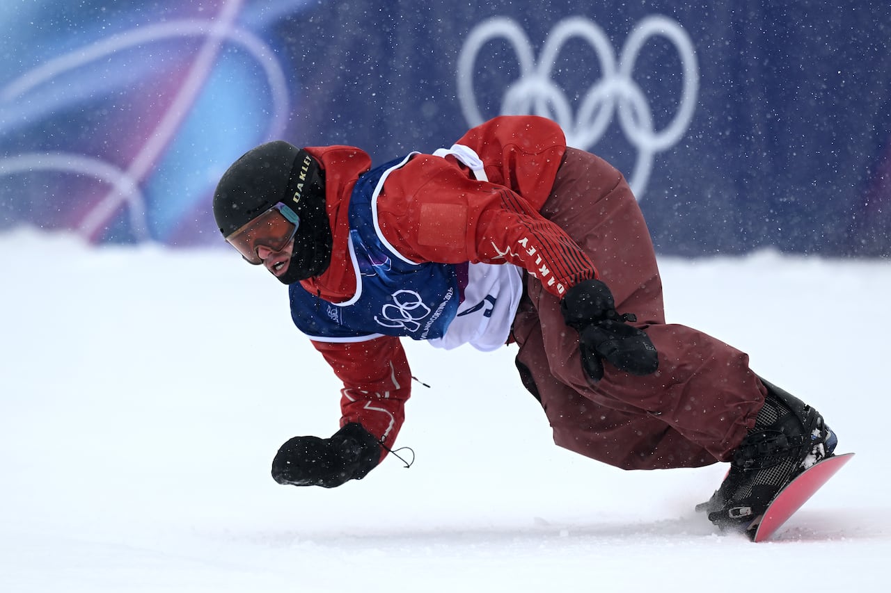 A snowboarder competes.