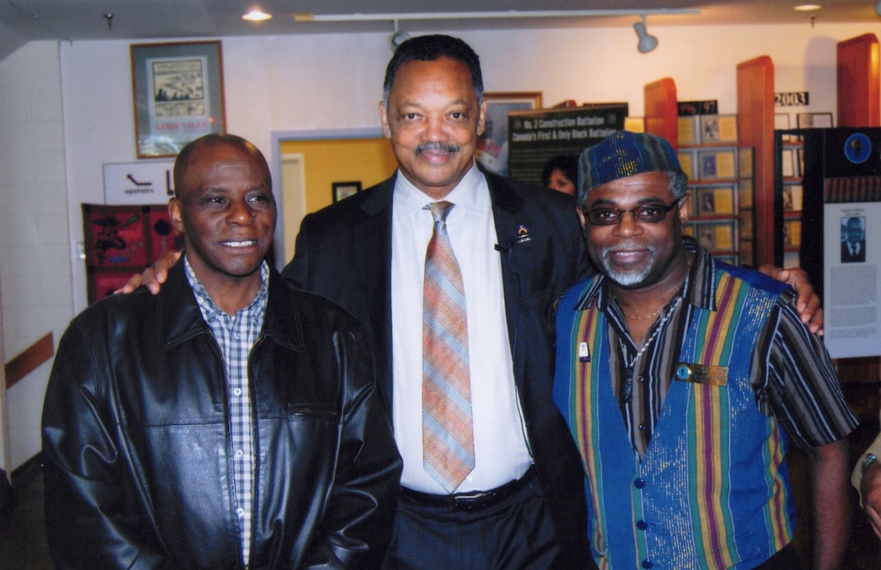 three men standing next to each other