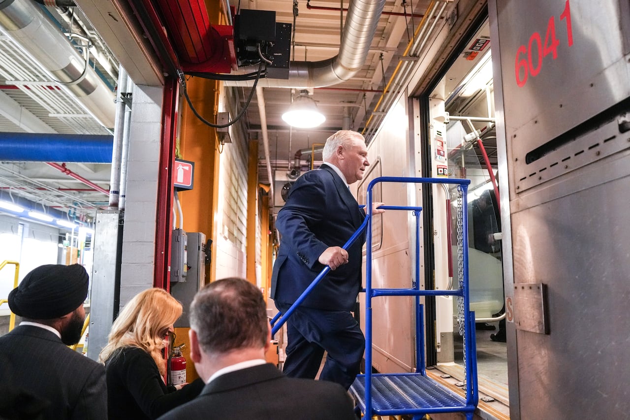Ontario Premier Doug Ford walks up to a subway car after holding a media availability at the TTC Davisville Yard Subway in Toronto  on Wednesday  February 18, 2026. THE CANADIAN PRESS/Chris Young