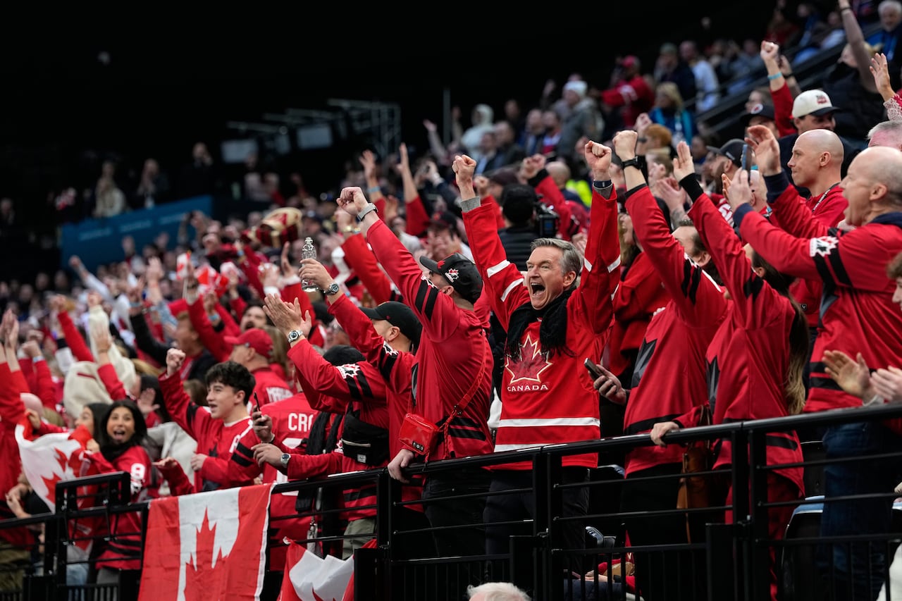 Red-clad fans join in celebration.