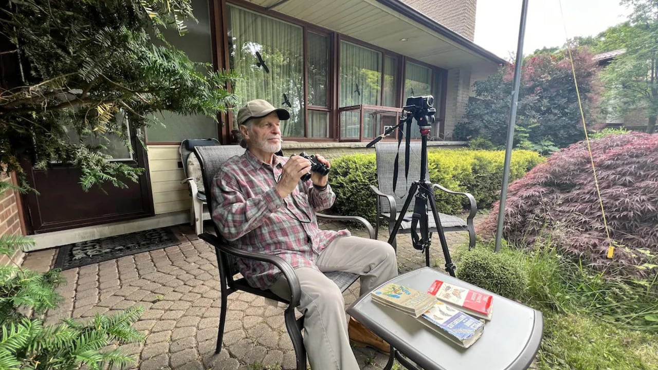 Wolf Ruck seen watching birds in his property in Mississauga. 