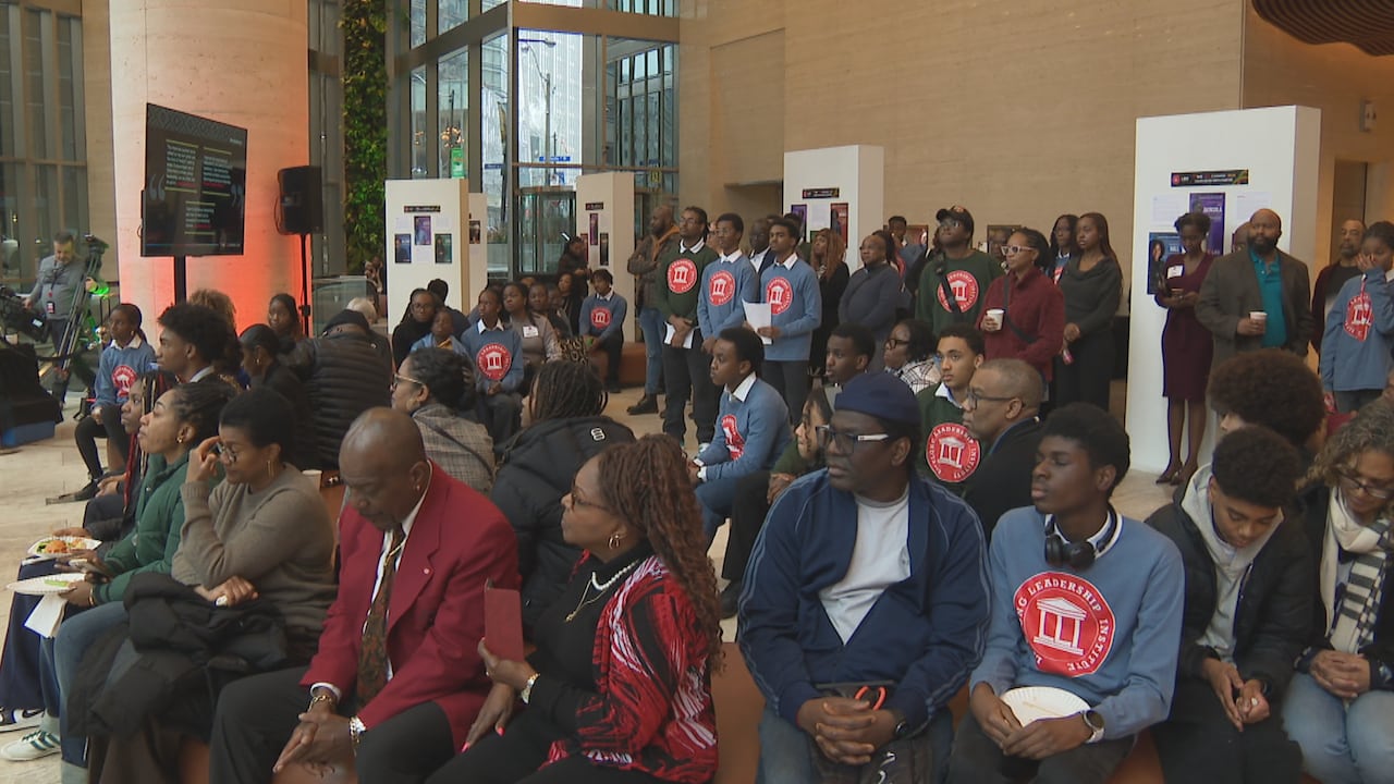 Crowd of people sitting and standing.