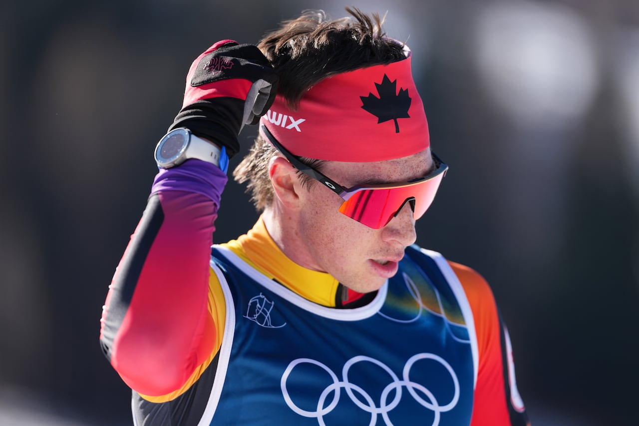 A skier reacts after finishing a race.