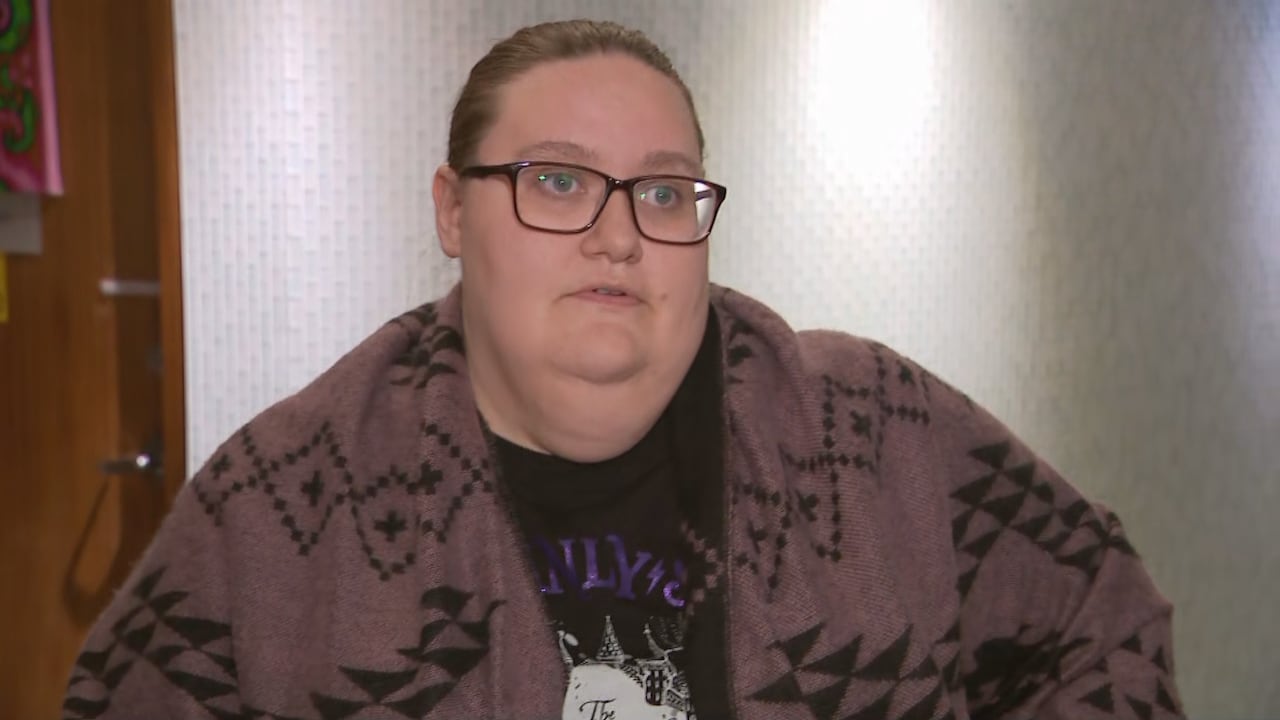 Woman in a purple scarf.