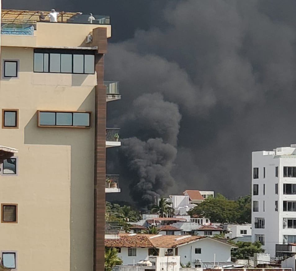 Fire at far away building with thick black smoke