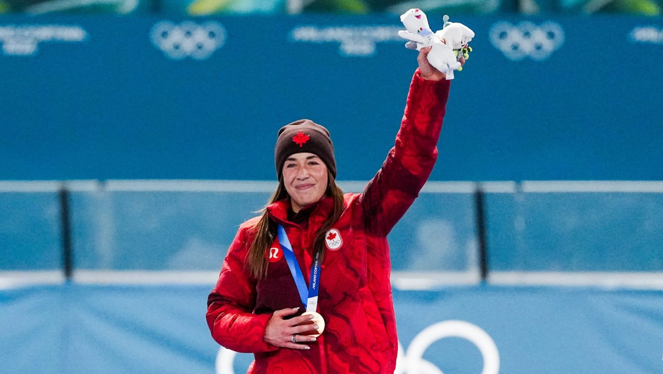 Valerie Maltais celebrating with medal in Women's 3000m Speed Skating
