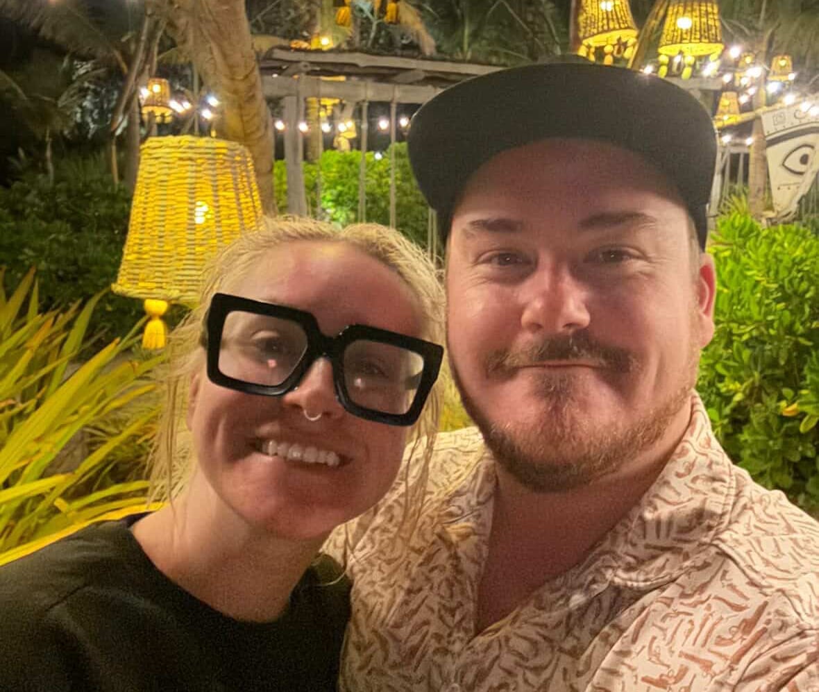 A couple embrace in a selfie