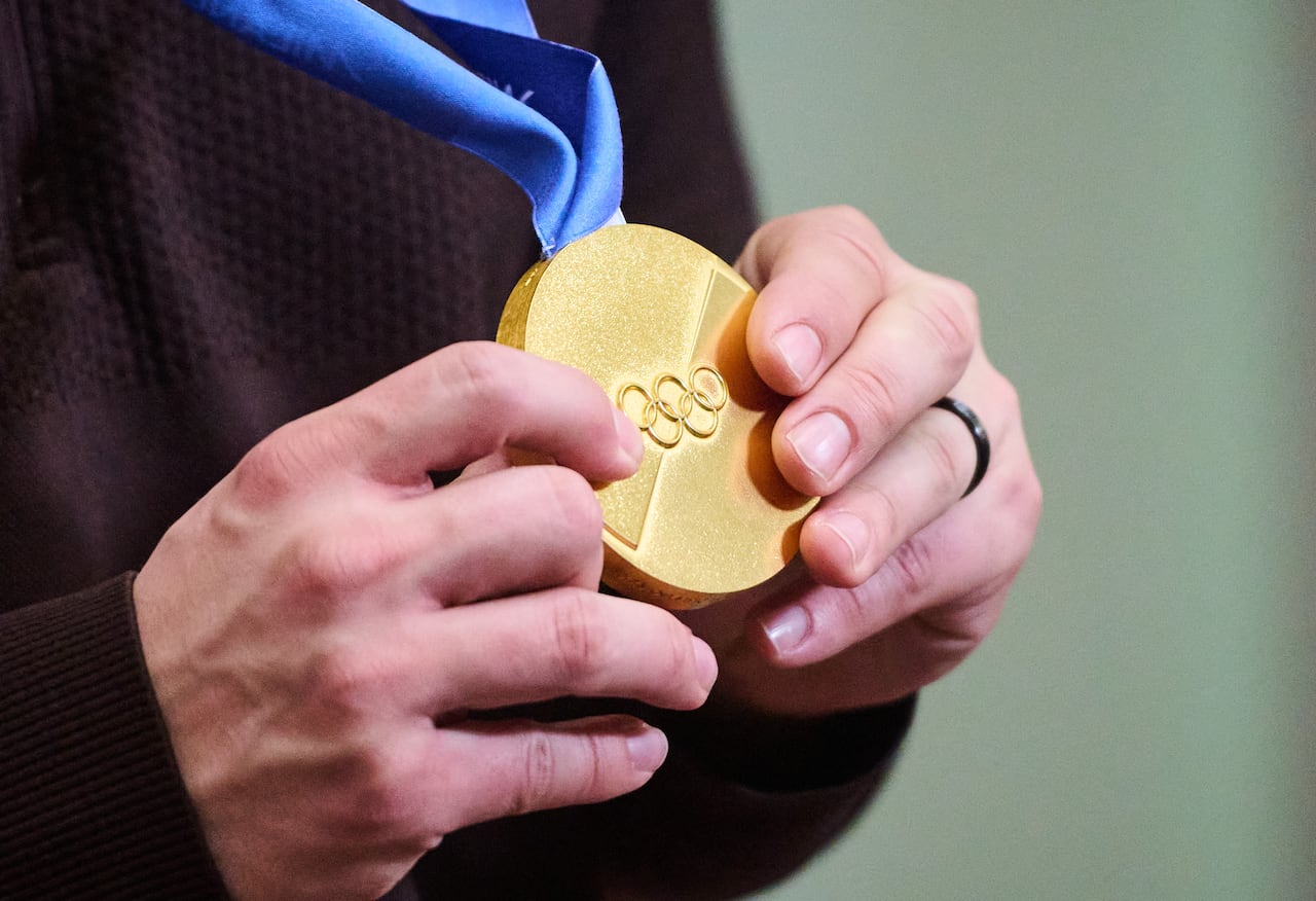 A close-up of an Olympic gold medal.