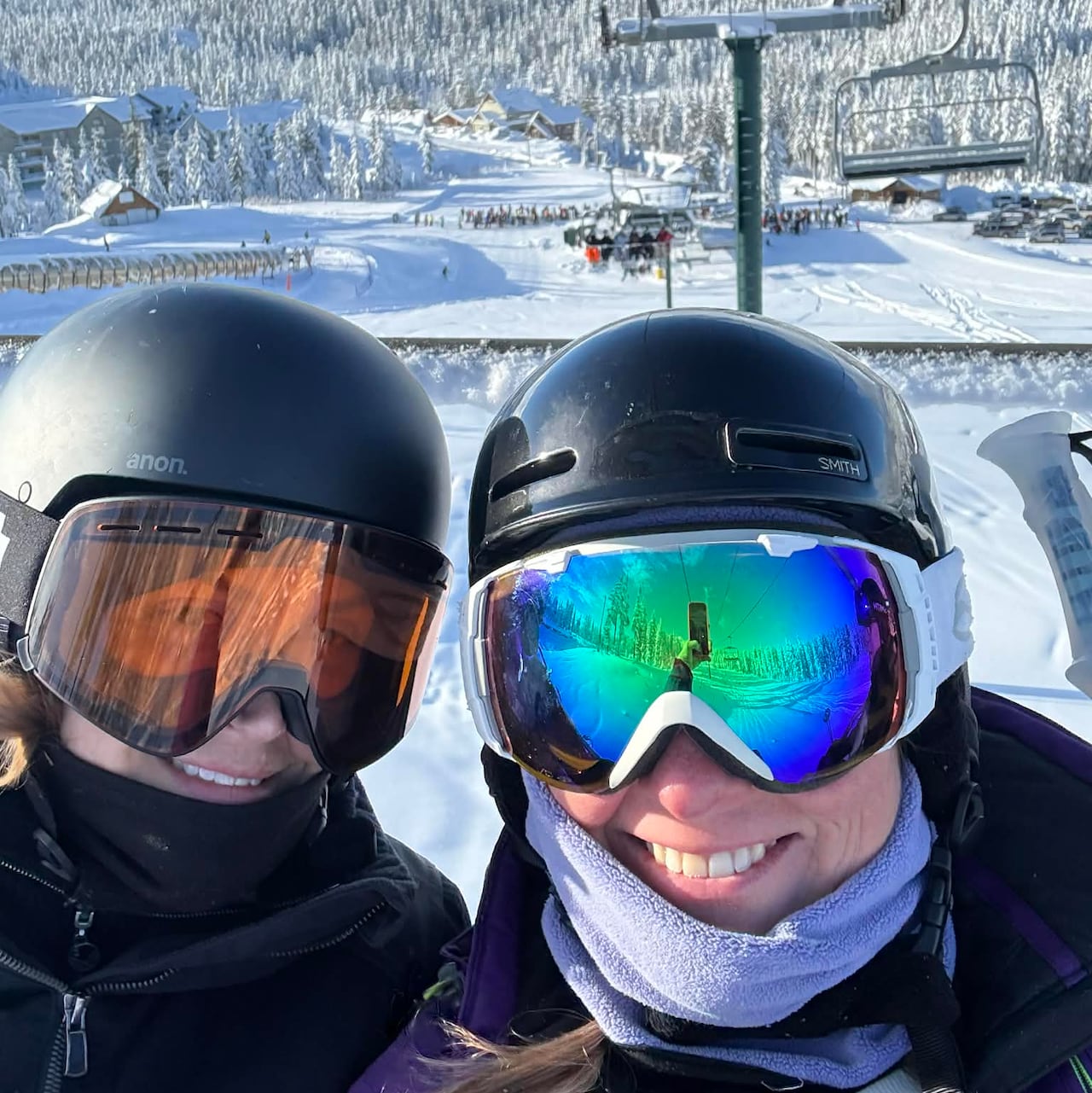 Jane Mepham and her friend Dana Peters take in a chairlift ride as they enjoy the fresh snow fall 
