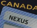 A NEXUS card and a Canadian passport are pictured in Ottawa on Tuesday, Jan. 17, 2023. 