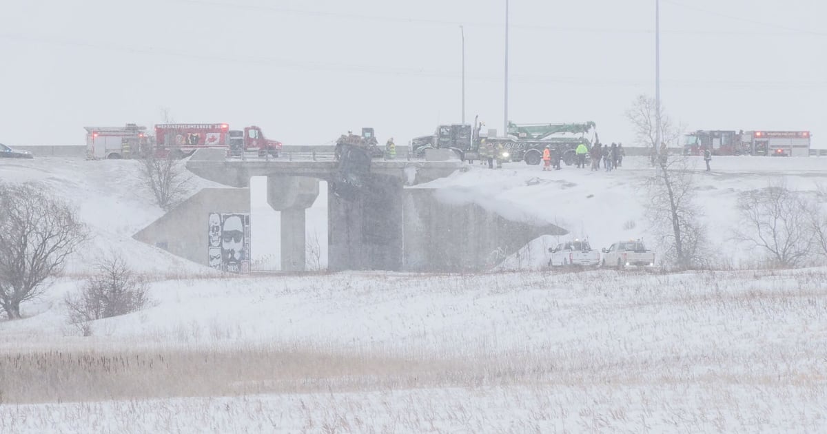 Truck hanging off Perimeter Highway bridge