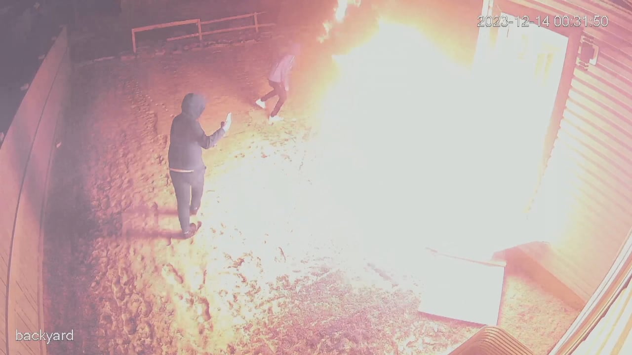 Edmonton police have released surveillance footage showing two individuals setting fire to a home last December.