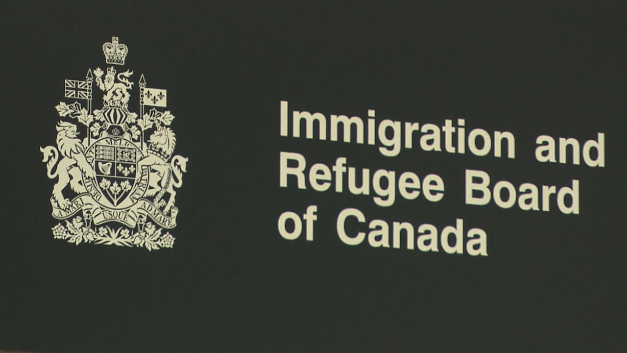 A police officer points to the Vehicle Identification Number (or VIN)