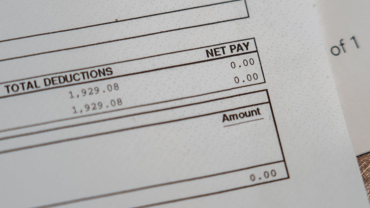 A pay stub shows $0 as net pay.