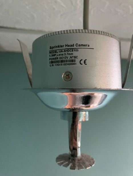 A camera that looks like a sprinkler head.