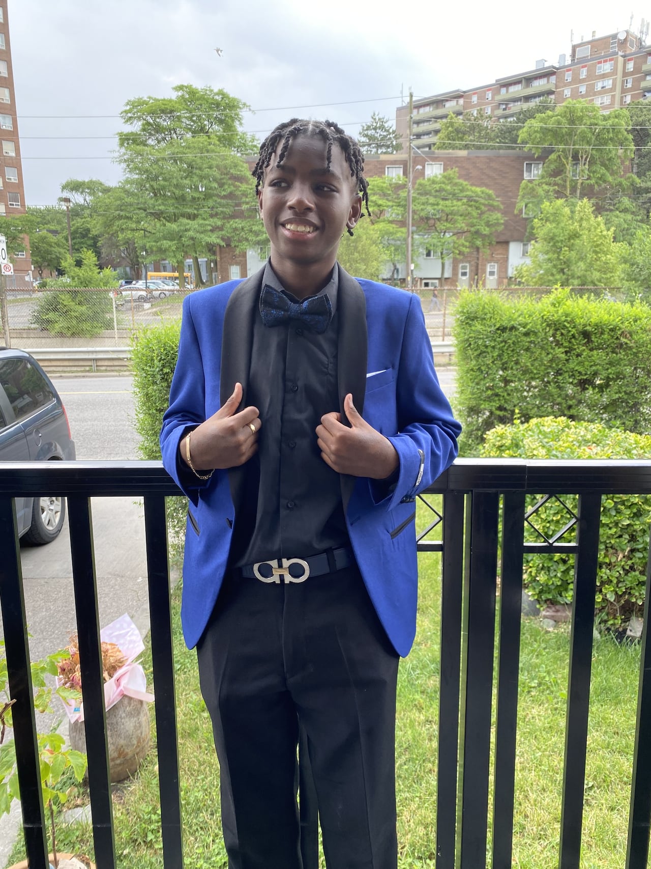 A teenage boy poses for a photo. 