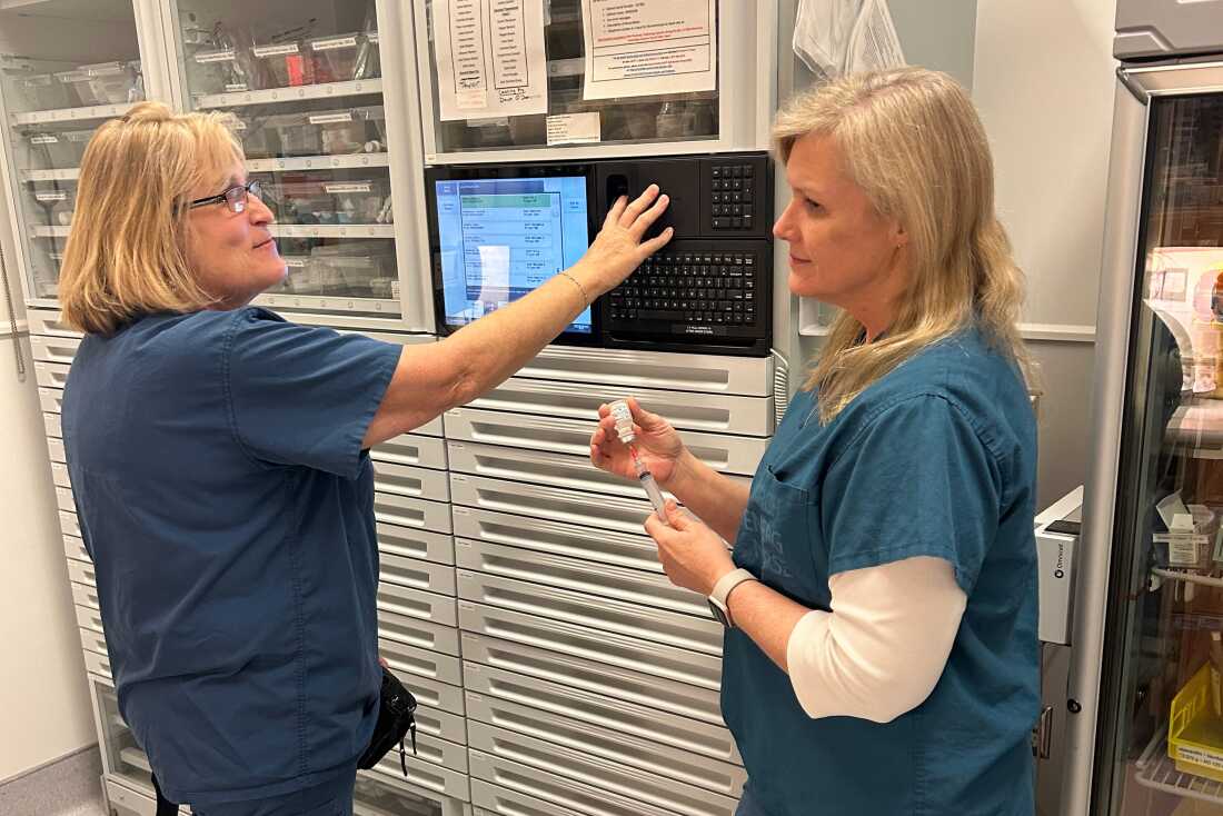 Nurses Brandy Frye (left) and Susan Fleishman work the night shift at Nanaimo Regional General Hospital in British Columbia. Both said they left their longtime U.S. jobs last year to get away from the policies and hateful rhetoric of President Trump.