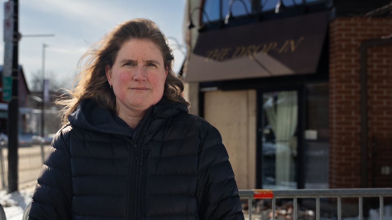 A woman wearing a black jacket