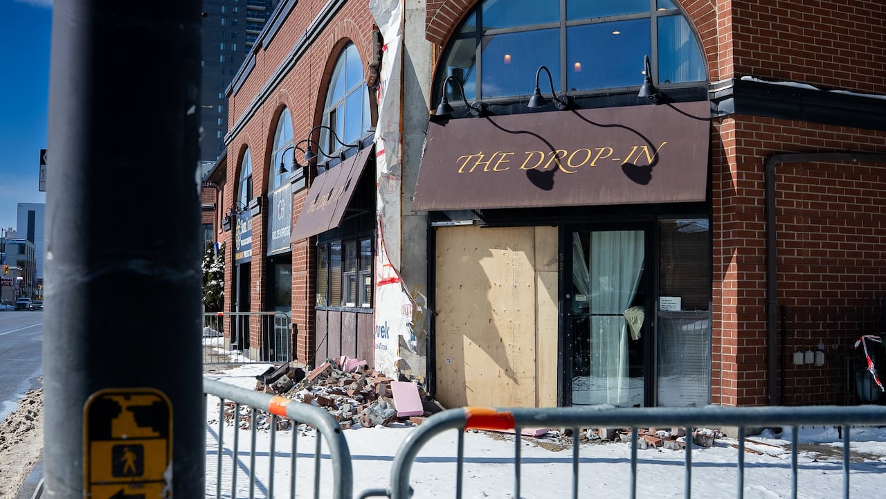 rubble in front of a damaged building