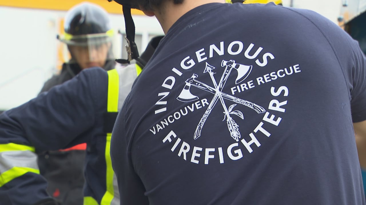 A man with a shirt back reading 'Indigenous Vancouver Fire Rescue Firefighters'.
