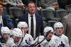 Vancouver Canucks head coach Adam Foote looks on from the team bench in a Dec. 2, 2025, game in Denver.