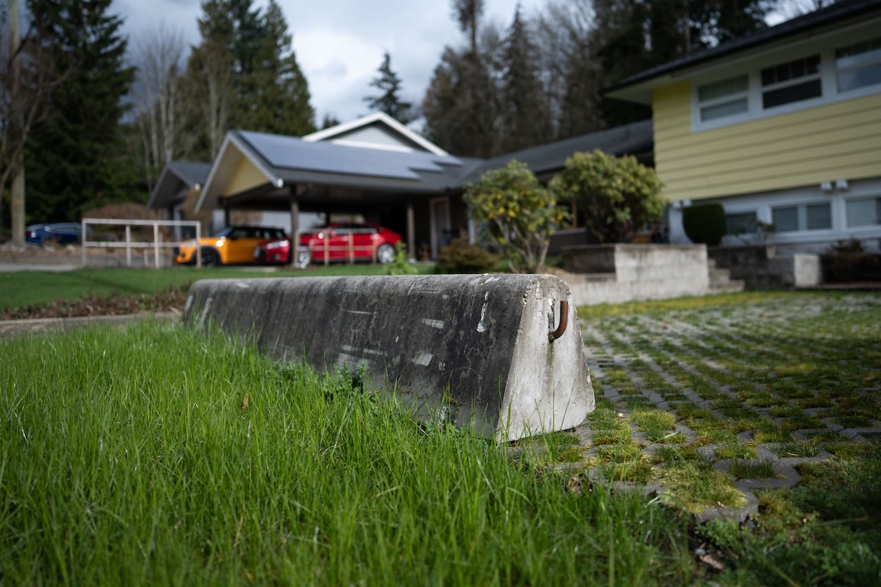 A concrete barrier is pictured in the driveway of 577 Shannon Crescent in North Vancouver, B.C. on February 27, 2026