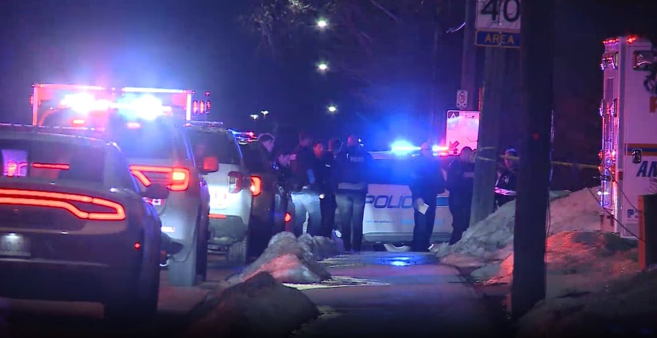 Police officers on a residential street.