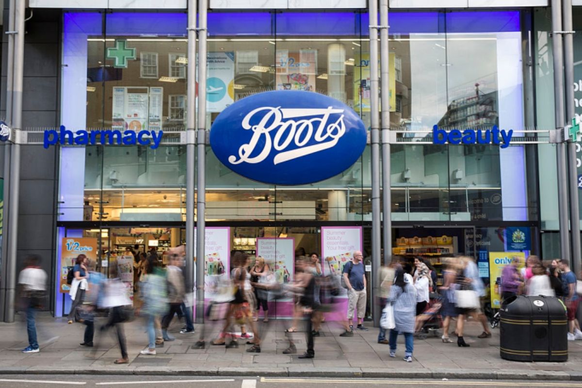 Members of the public walk past a branch of Boots the chemist on Oxford Street on August 6, 2014 in London, England.
