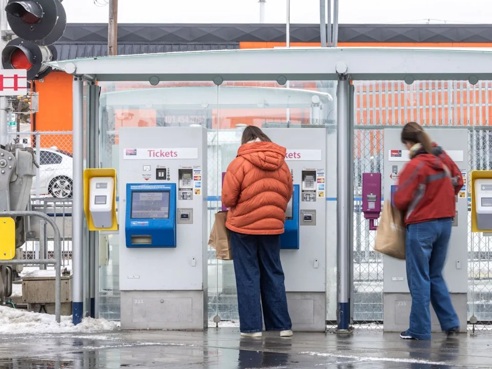 Transit riders purchase tickets at the Chinook CTrain Station in Calgary on Tuesday, Dec. 2, 2025.
