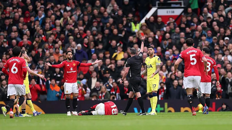 Cristiano Romero is shown a red card