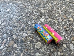 Close of used fireworks left on the ground as litter.