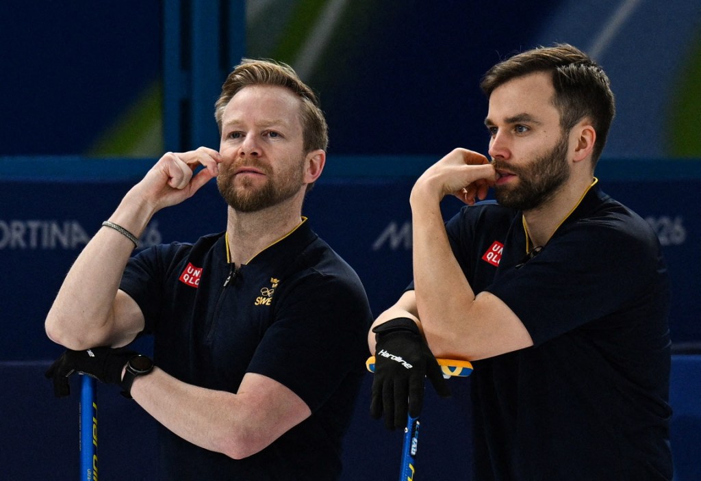 Niklas Edin and Oskar Eriksson of Sweden during a curling match.