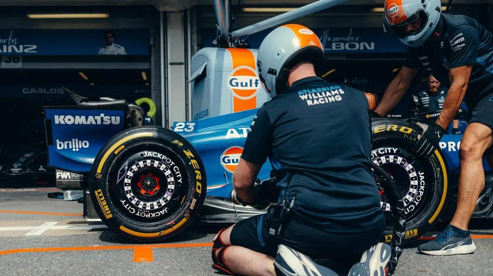 pit crew working on a formula 1 car during a race pit crew working on a formula 1 car during a race