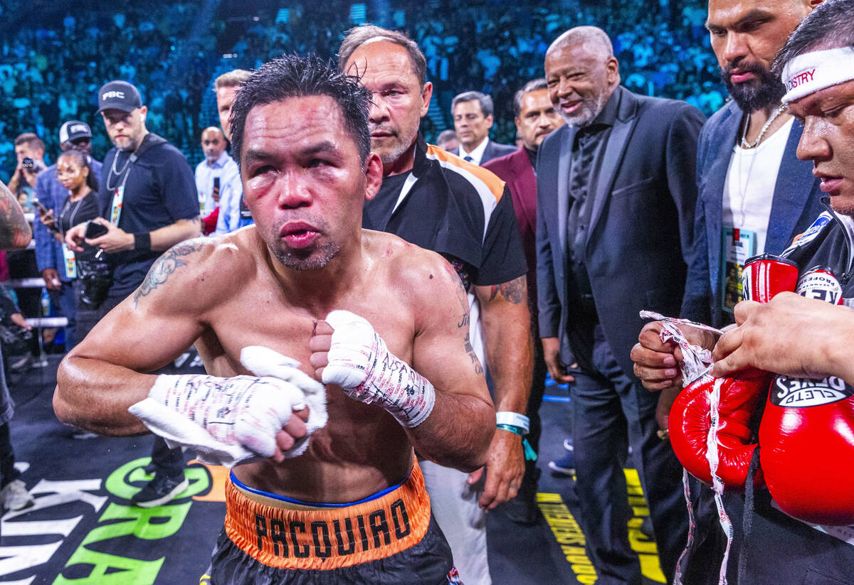 Manny Pacquiao shadow boxes as he awaits the decision against Mario Barrios during their WBC we ...