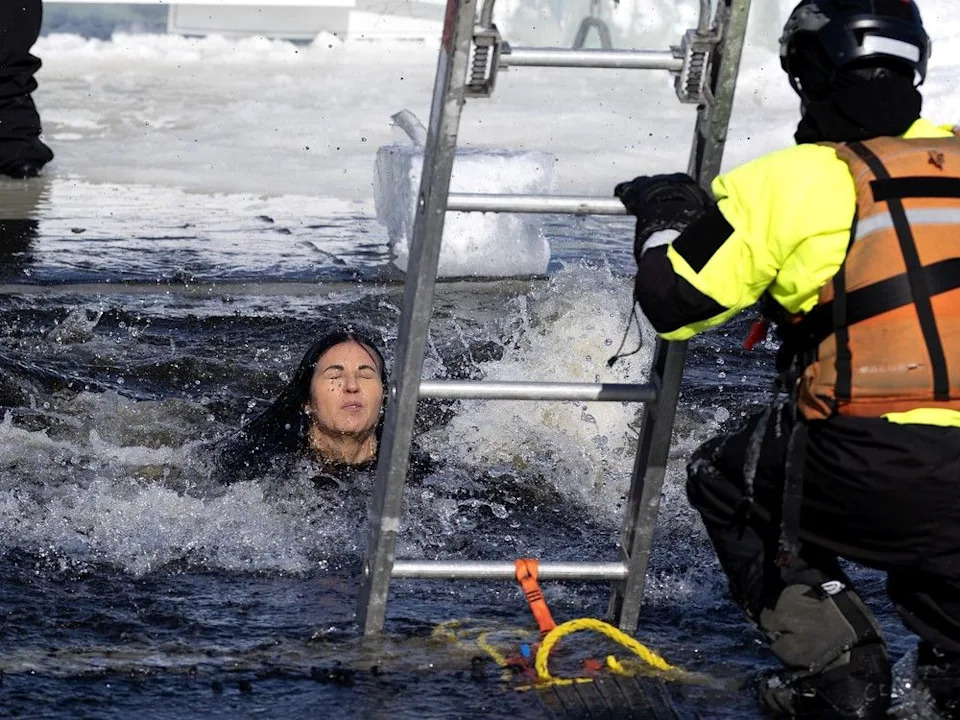 Montreal Mayor Soraya Martinez Ferrada resurfaces after jumping into the St. Lawrence River during the SPVM polar plunge in Montreal.