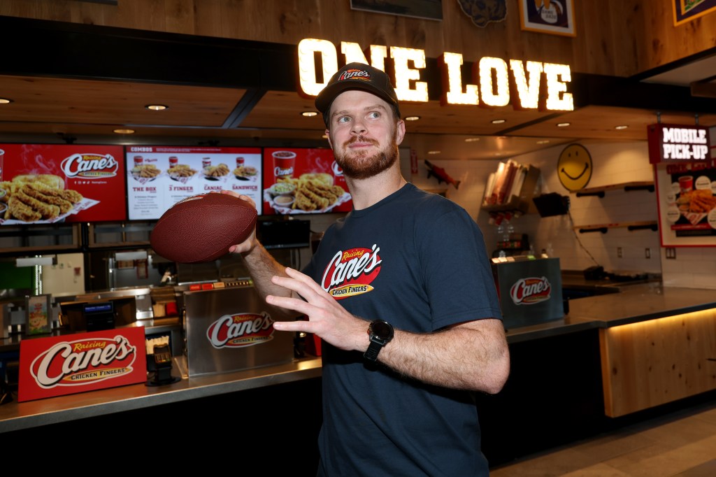 Seahawks quarterback Sam Darnold works a Celebratory Super Bowl "Shift" at Seattle's First Raising Cane's on February 10, 2026 in Seattle, Washington. 