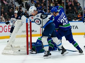 Gabriel Vilardi of the Winnipeg Jets celebrates after scoring a goal on Nikita Tolopilo of the Vancouver Canucks during the second period at Rogers Arena on Wednesday night.