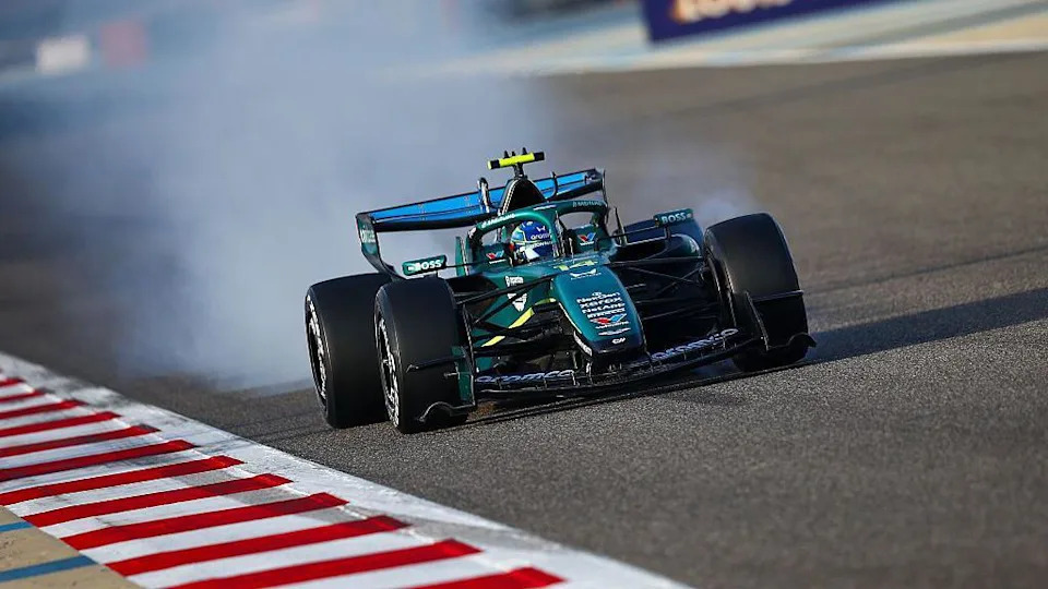 Fernando Alonso locks up in the Aston Martin on track during pre-season testing in Bahrain 