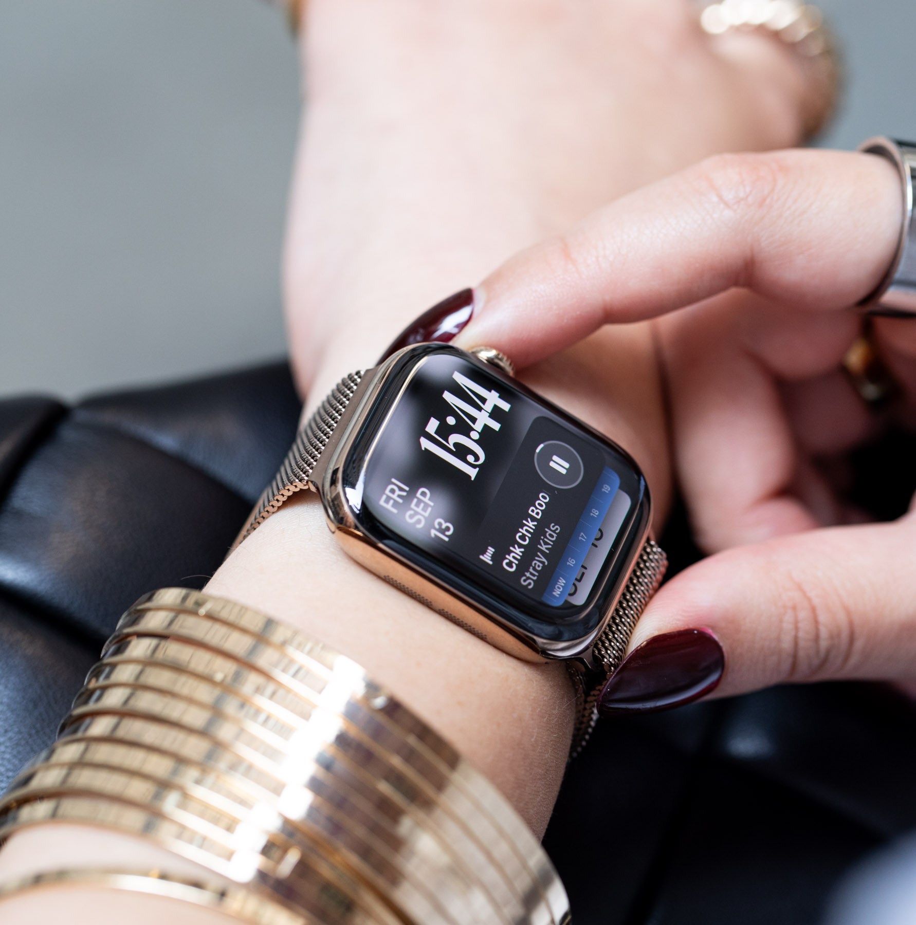 Person looking at music widget on Apple Watch Series 10