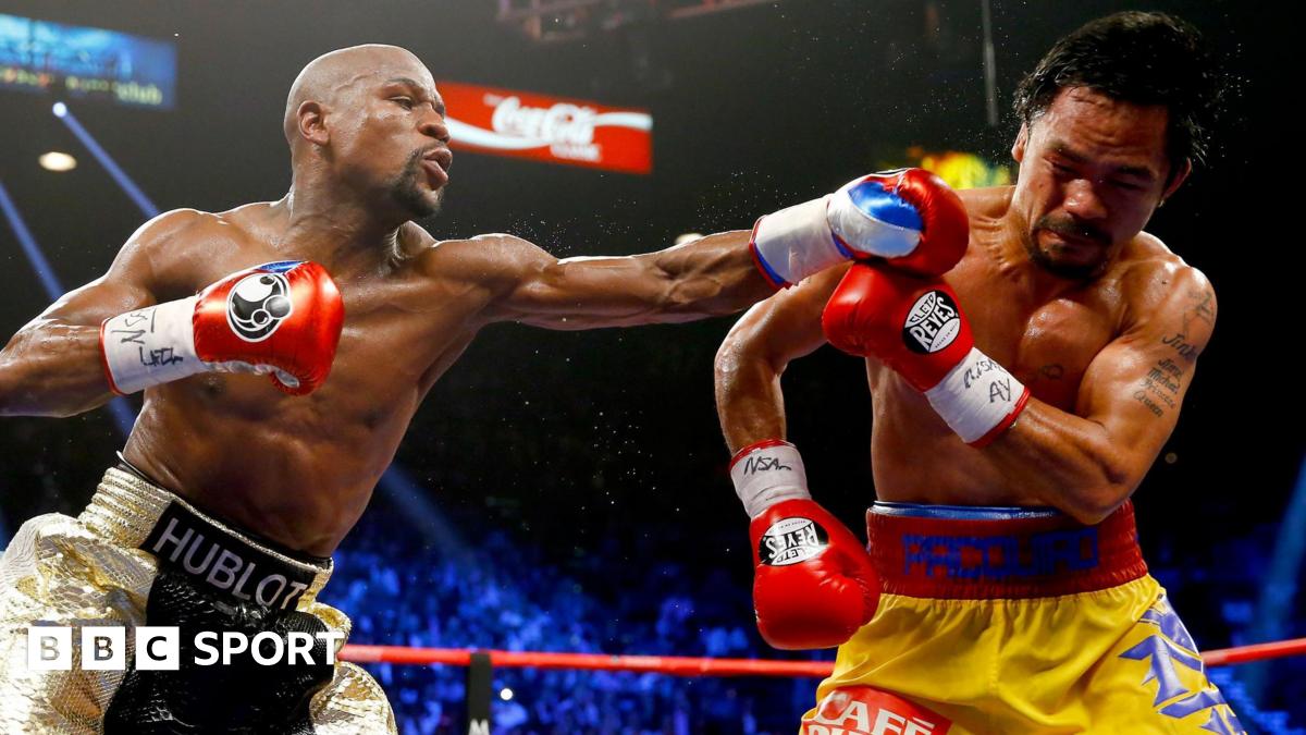 Floyd Mayweather throws a punch at Manny Pacquiao during their welterweight unification championship bout in May 2015 at MGM Grand Garden Arena in Las Vegas