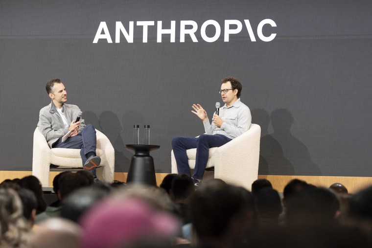 Anthropic CEO Dario Amodei, right, and Chief Product Officer Mike Krieger talk after unveiling Claude 4 during the Code with Claude conference on Thursday, May 22, 2025 in San Francisco.
