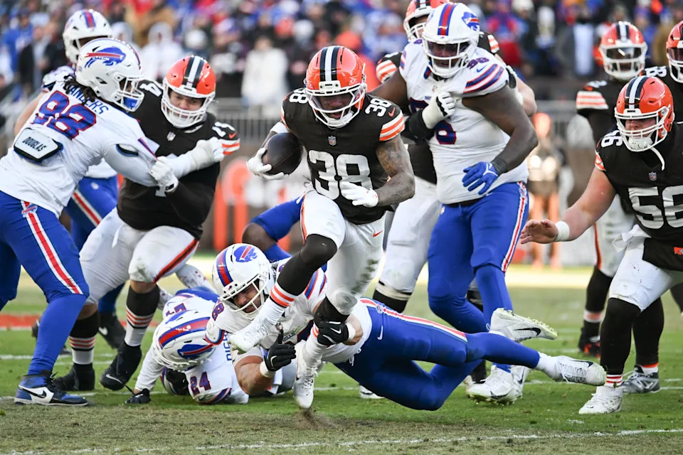 Dec 21, 2025; Cleveland, Ohio, USA; Cleveland Browns running back Trayveon Williams (38) carries the ball as Buffalo Bills linebacker Matt Milano (58) defends during the second half at Huntington Bank Field. Mandatory Credit: Ken Blaze-Imagn Images