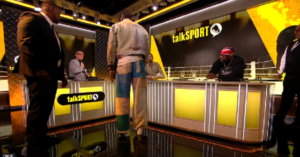 Watch how Deontay Wilder was restrained by security after Tyson Fury question