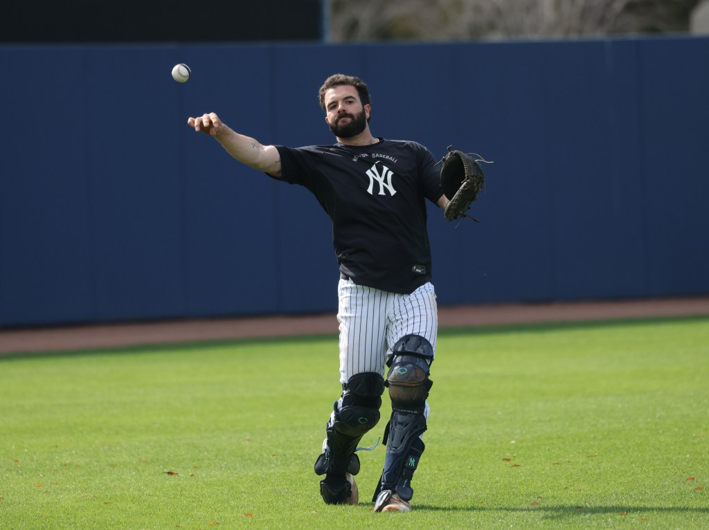 New York Yankees catcher Austin Wells throwing a ball during spring training.