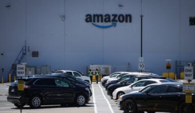 Security guards walk in the parking lot outside Amazon