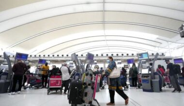People wait in line to check in at Pearson International Airport in Toronto on Thursday, May 12, 2022. THE CANADIAN PRESS/Nathan Denette